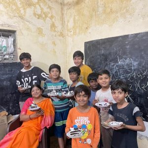 Swayam Chairperson having sweets with Gulbai Tekra children_2023-24